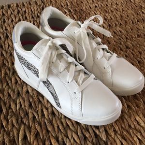 Ryka sneakers. Bright white/faux snake print embossed detail. Internal wedge. 9